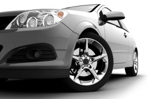 Car front bumper, light and wheel on white